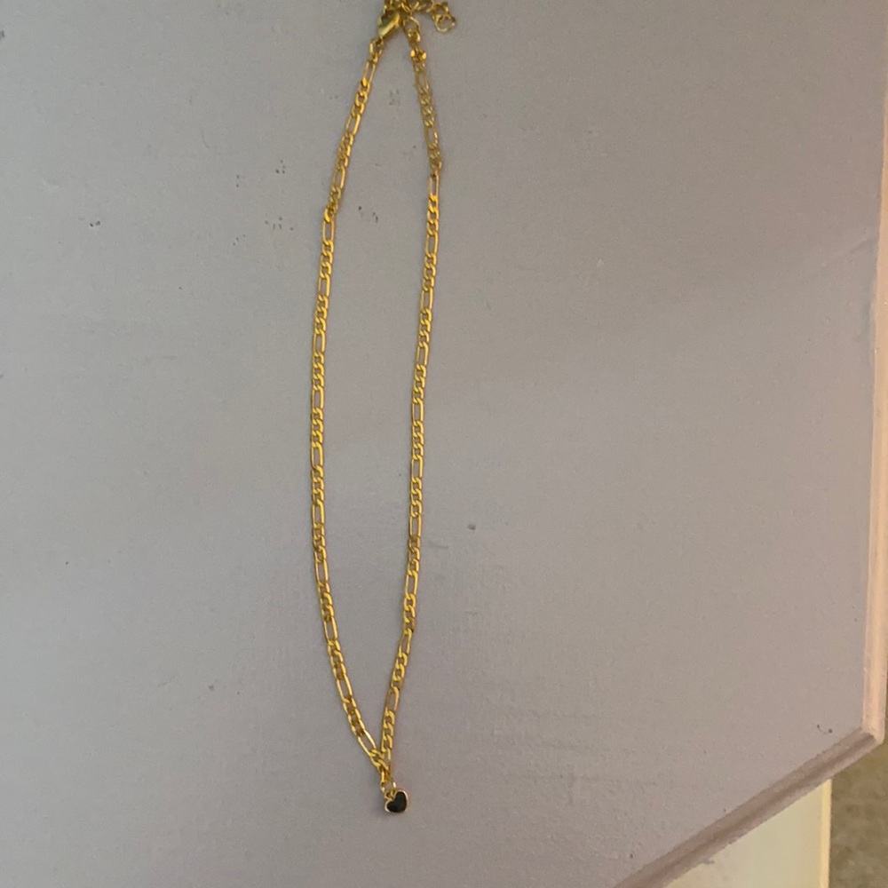 Gold choker with black heart